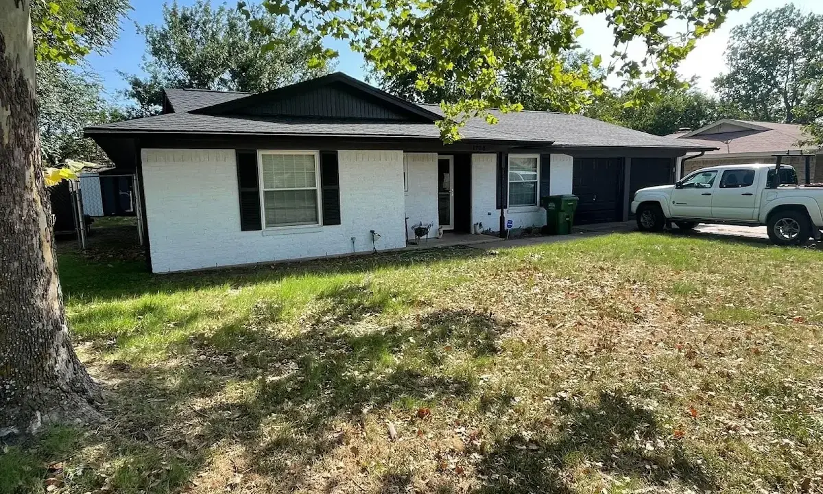 Professional roofing crew working on a residential roof in Flatwoods